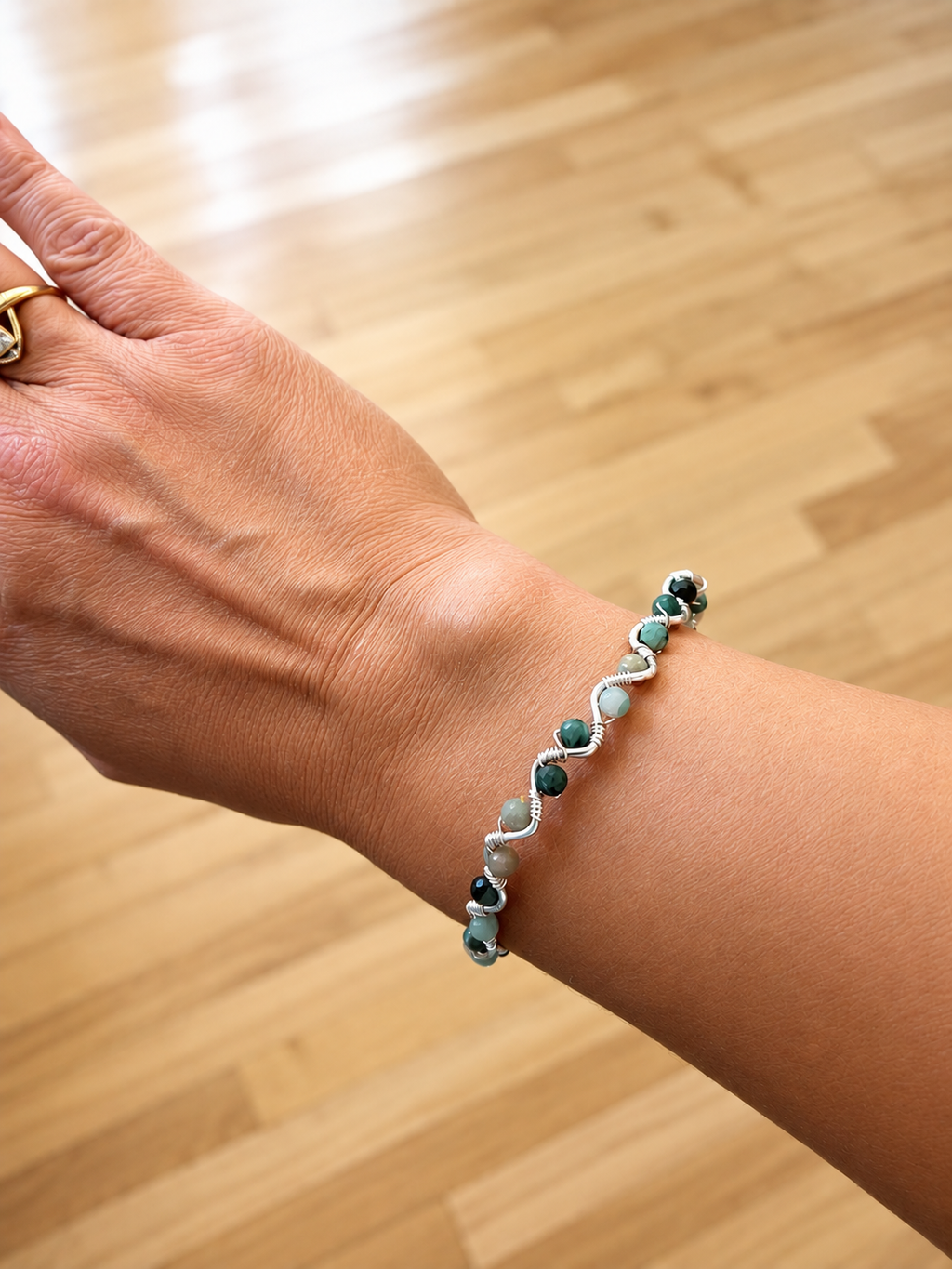 Emerald wire wrapped bracelet